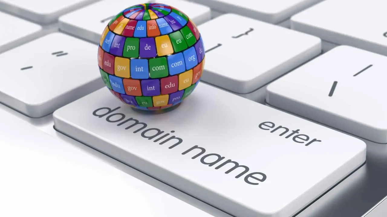 Colorful globe of domain extensions such as com, org and edu resting on a keyboard key labeled domain name